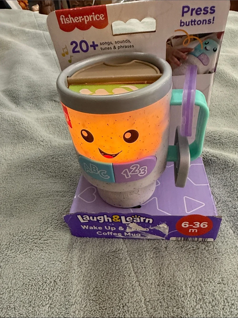Fisher-Price Laugh & Learn Light-Up Learning Mug in Blue, Purple, Teal, Gray